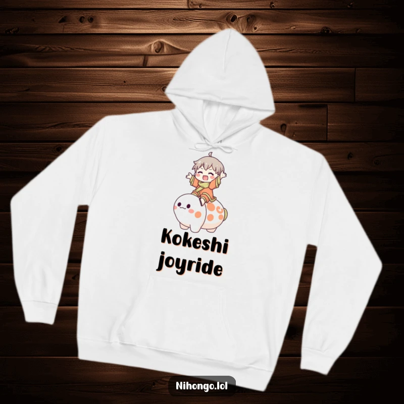 Funny Hoodie: Character happily rides a big, friendly Kokeshi doll, capturing a moment of pure joy and playful spirit.